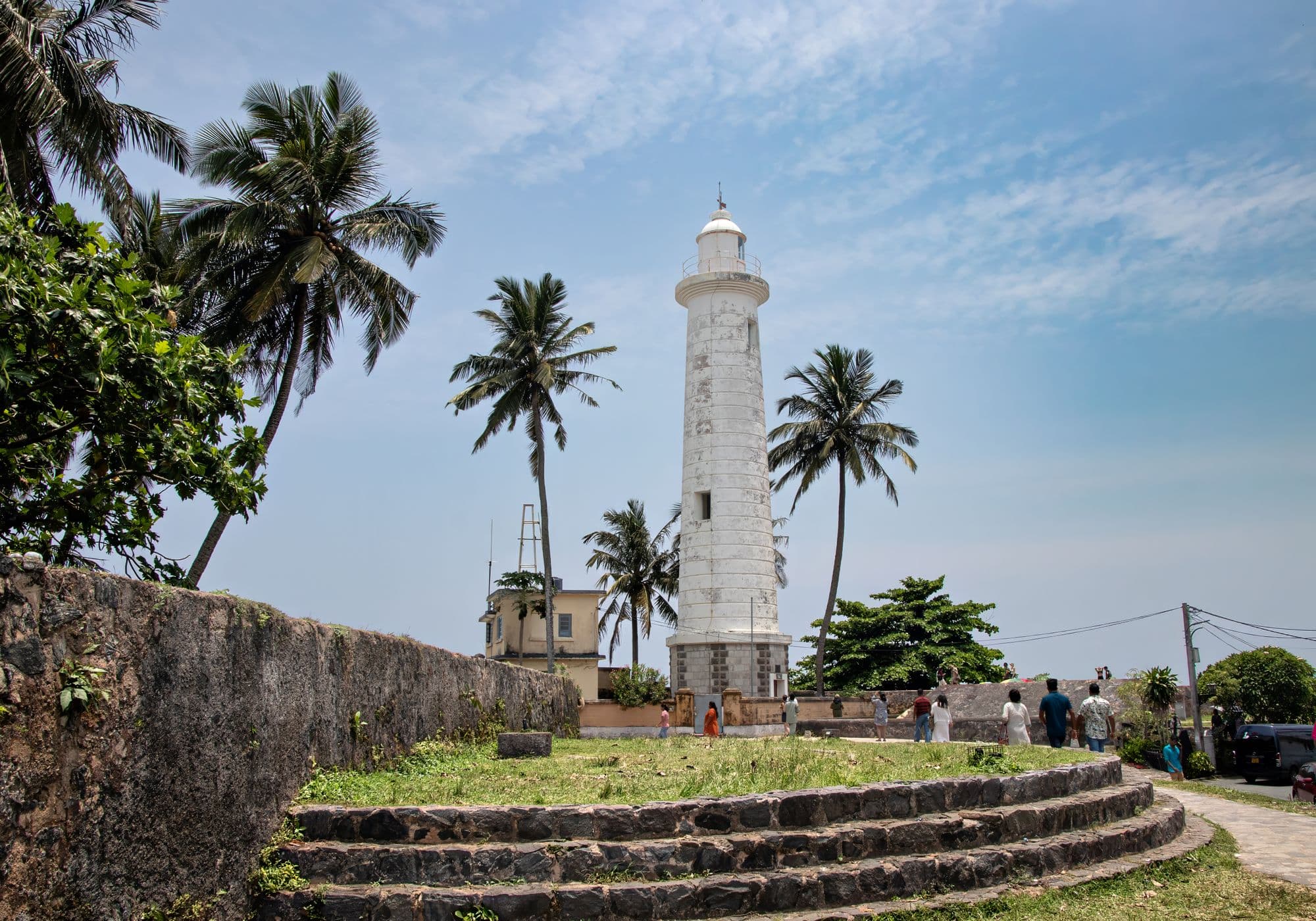 The white lighthouse and ramparts of Galle Fort above the Indian Ocean