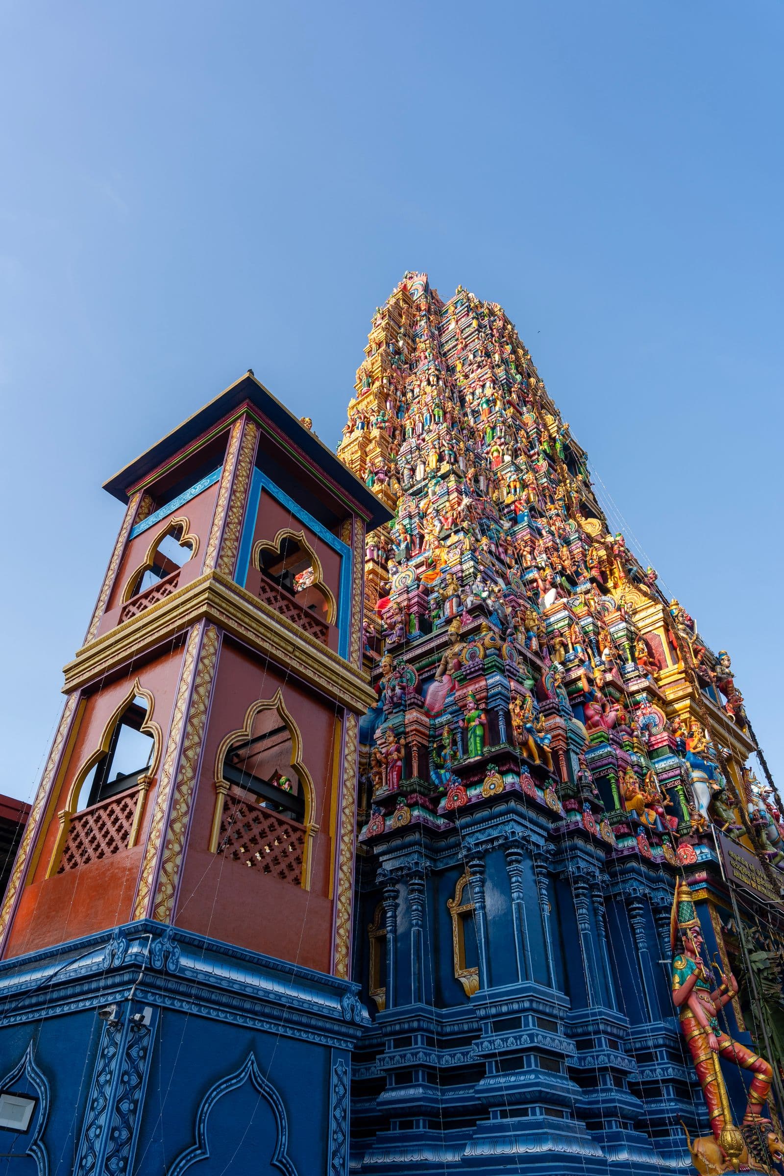 A brightly painted Hindu kovil gopuram against a clear sky in northern Sri Lanka