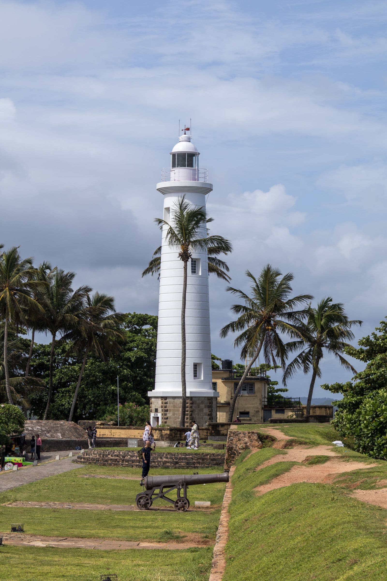 The lighthouse and ramparts of Galle Fort above the sea at sunset